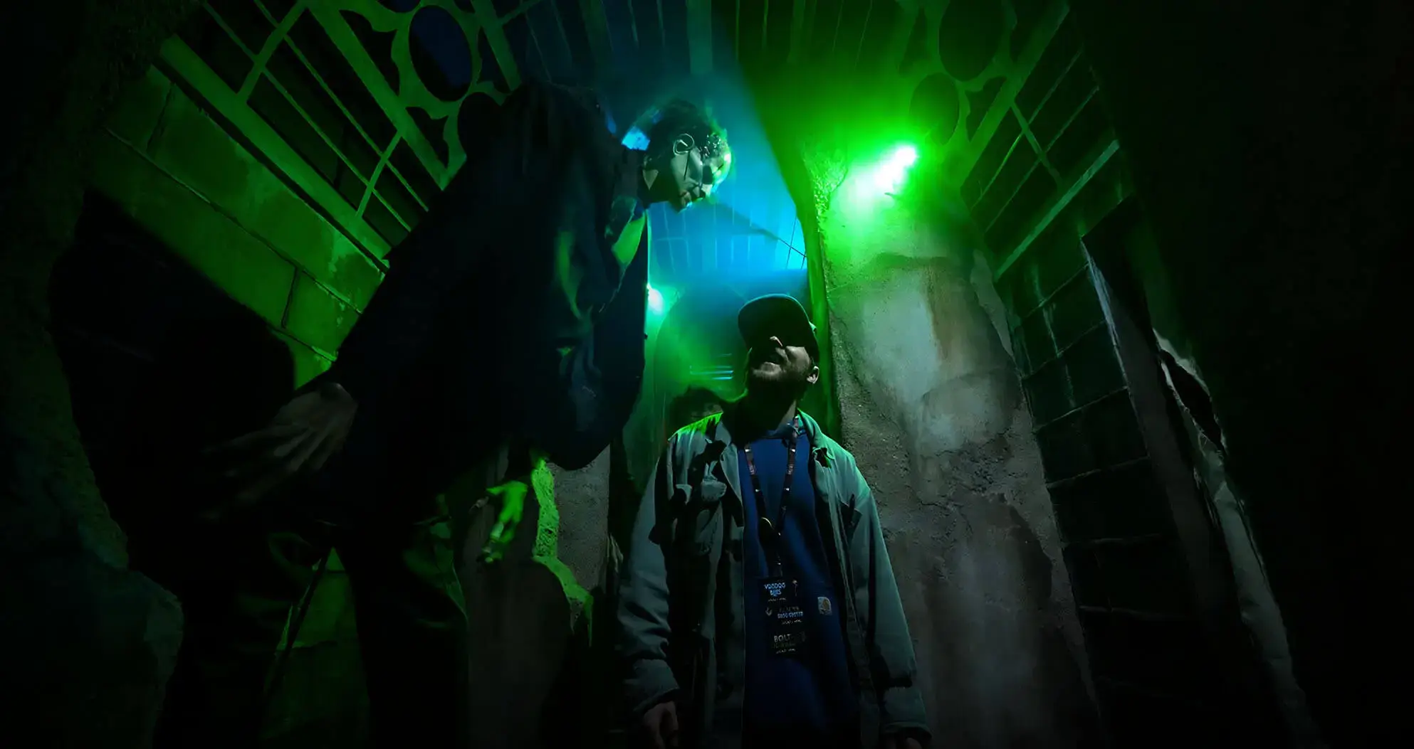 Scare actor looming over guest at haunted house